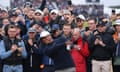 Tiger Woods plays a shot in front of a large gallery during his second round at Troon.