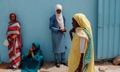 Malian refugees wait to be seen by a member of UNHCR at a registration centre in Mbera camp.