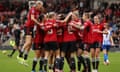 Manchester United’s players celebrate Nikita Parris’s second goal against Brighton. 