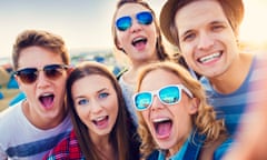 Five teenagers looking very happy at a festival