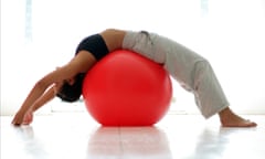 Woman stretching on exercise ball