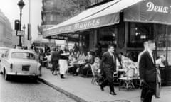 The Cafe Aux Deux Magots In The Saint Germain District In 1960. \The Rue De Rennes In The Background, On The Left.<br>FRANCE - JANUARY 01:  The cafe AUX DEUX MAGOTS in the Saint Germain district in 1960. The rue de Rennes in the background, on the left.  (Photo by Keystone-France/Gamma-Keystone via Getty Images)