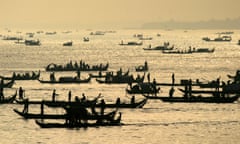 Cambodian fishermen set out at dawn on the Mekong river.