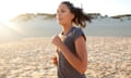 Young woman running at sunset on Australian beach