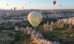 An aerial view of hot air balloons during sunset in Nevşehir, Turkey