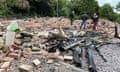 People inspect the remains of the Crooked House pub in Himley, which was demolished two days after it was gutted by fire