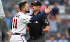 Atlanta Braves center fielder Ender Inciarte is blocked by an umpire as he attempts to enter the brawl in the first inning