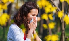 Woman blowing her nose