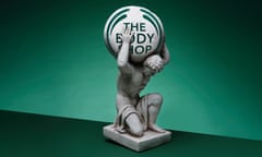 statue of man holding up a body shop ball