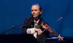 A woman plays a violin.