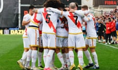 Rayo Vallecano's players celebrate after Raúl de Tomás’s equaliser against Real Madrid.