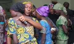 Oludolapo Osinbajo, the wife of the vice-president of Nigeria, hugs one of 21 Chibok girls released by Boko Haram.