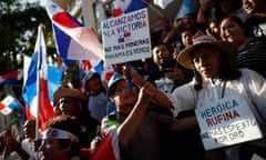 People celebrate after the supreme court decision in Panama City on 28 November. The sign reads: ‘We achieve victory. No more mining. Panama is green.’