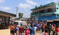 Family members and friends gather outside Redemption hospital in Monrovia, Liberia, on Thursday.