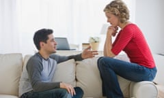 Couple talking on sofa