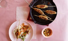 Pork skewers with peanut and coriander dressing