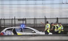 Police officers are seen during a police operation on the Sydney Harbour Bridge in Sydney, Wednesday, April 4, 2018. A man has climbed onto Sydney Harbour Bridge sparking a major police operation and causing traffic chaos as peak hour hits. Police negotiators remain on the road trying to talk down the man, who climbed the bridge just after 4.30am on Wednesday. (AAP Image/Mick Tsikas) NO ARCHIVING