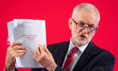 Jeremy Corbyn holds an unredacted copy of the dossier. 