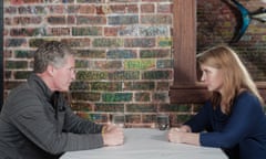 Ted and April sitting at a restaurant table