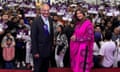 Shilpa Shetty and Keith Vaz pose for a photo in a hall filled with people holding up signs saying 'Keith Vaz'.