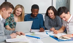 Group Of Teenage Students Working In Classroom