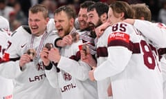 Latvia celebrate with their bronze medals after their world championship victory over the United States