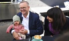 Australian Opposition Leader Anthony Albanese holds 4 months old Gabrielle Nina Ritchie during a coffee meeting with volunteers at Milk and Wine cafe on Day 30 of the 2022 federal election campaign, in Melbourne, Tuesday, May 10, 2022. (AAP Image/Lukas Coch) NO ARCHIVING