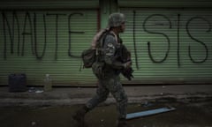 ***BESTPIX***Philippines Extends Martial Law in Mindanao<br>MARAWI, PHILIPPINES - JULY 22: Philippine Marines soldiers in a cleared street but are still in range of enemy sniper fire as they walk towards the main battle area on July 22, 2017 in Marawi, southern Philippines. The Philippine Congress voted on Saturday to extend martial law in the southern part of the country since it was imposed to crush a rebellion by Islamic State-inspired militants. The decision was made two days before President Rodrigo Duterte delivers his annual state of the nation address as analysts have reportedly said Mr. Duterte appears to be using the crisis in Marawi as an excuse to impose authoritarian rule in the Philippines. (Photo by Jes Aznar/Getty Images)***BESTPIX***