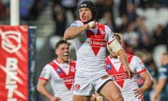 Jonny Lomax celebrates his try for St Helens against Warrington