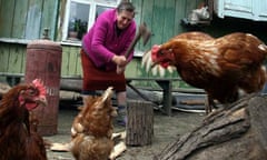 Woman chops wood, Belarus