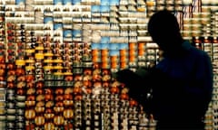 A VISITOR READS INFORMATION ABOUT RUSSIAN LOMOGRAPHIC PHOTOGRAPHY AT FIRST DAY OF BOOK FAIR 