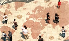 Tourists walk on map