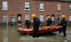 Firefighters in Yorkshire search homes in a flooded village