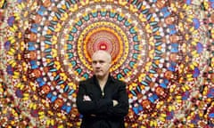 Forever young … Damien Hirst with a piece from his Doorways to the Kingdom of Heaven series.