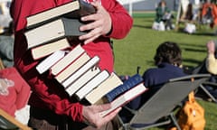 Man carrying pile of books at Hay festival 2007