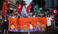 Women march at a rally for women's rights during the Rio+20 conference