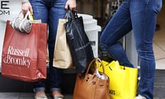 Shoppers stand with their bags in Oxford Street in London