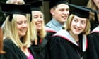 University students wearing mortarboards graduate