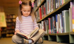 Girl reading book in library