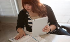 Girl with ipad doing maths