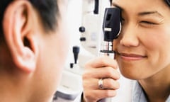 Student optometrist examining patient