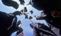 Graduates throwing their caps into the air