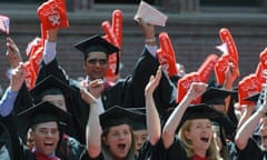 Harvard Business School students cheer as their MBA degrees