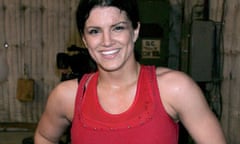 Gina Carano: dark-haired smiling woman in a tank top