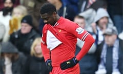 Liverpool's Kolo Touré looks dejected after his mistake led to West Bromwich's Albion's equaliser