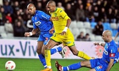 Nantes forward Aurelien Capoue and Lyon defender Jean-Alain Boumsong, left, and Cris