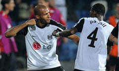 Diomansy Kamara celebrates with John Pantsil.