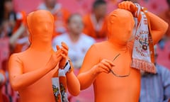 Blackpool fans in skin suits take in the scene at Wembley