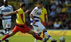 QPR's Alejandro Faurlín plays a pass ahead of Watford's John Eustace