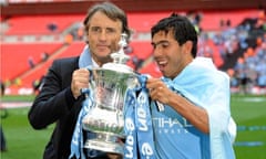 Roberto Mancini and Carlos Tevez